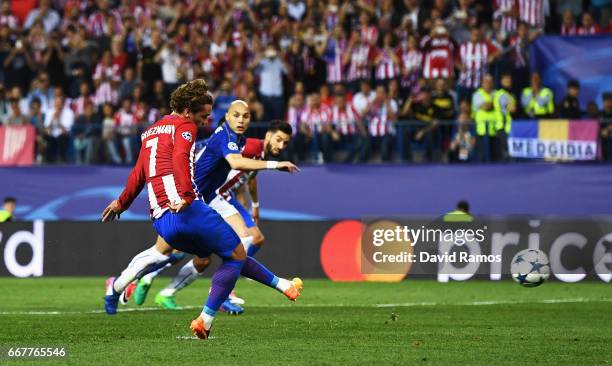 Antoine Griezmann of Atletico Madrid scores the opening goal of the game from the penalty spot during the UEFA Champions League Quarter Final first...