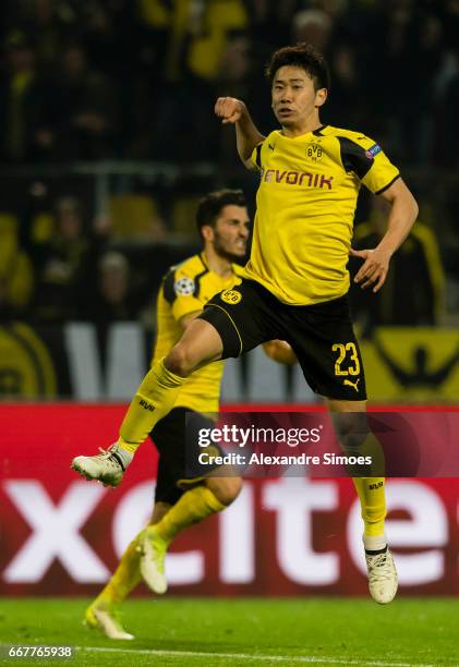 Shinji Kagawa of Borussia Dortmund celebrates after scoring the goal to the 2:3 during the UEFA Champions League Quarter Final: First Leg match...