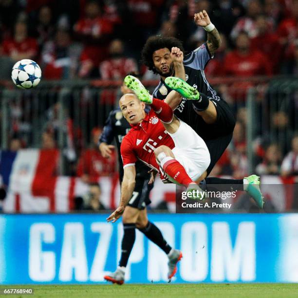 Arjen Robben of Bayern Munich is challenged by Marcello of Real Madrid during the UEFA Champions League Quarter Final first leg match between FC...