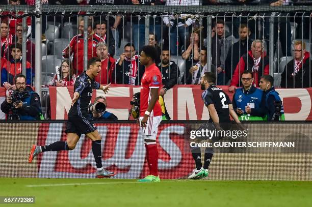 Madrid's Portuguese forward Cristiano Ronaldo celebrates his goal during the UEFA Champions League 1st leg quarter-final football match FC Bayern...