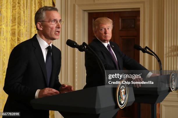 Secretary General Jens Stoltenberg and U.S. President Donald Trump hold a news conference in the East Room of the White House April 12, 2017 in...