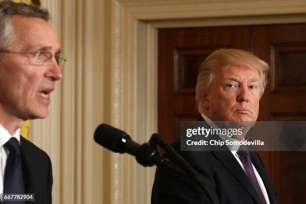 Secretary General Jens Stoltenberg and U.S. President Donald Trump hold a news conference in the East Room of the White House April 12, 2017 in...