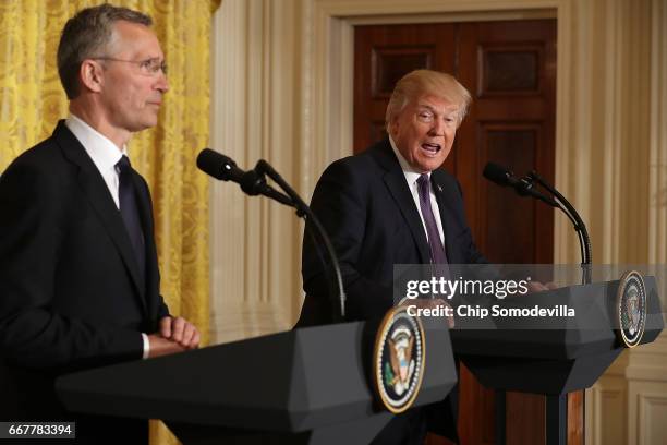 Secretary General Jens Stoltenberg and U.S. President Donald Trump hold a news conference in the East Room of the White House April 12, 2017 in...