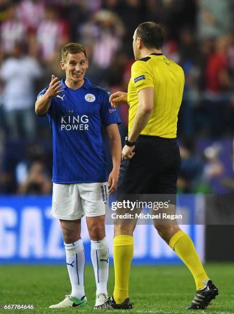 Marc Albrighton of Leicester City talks to referee Jonas Eriksson after the UEFA Champions League Quarter Final first leg match between Club Atletico...