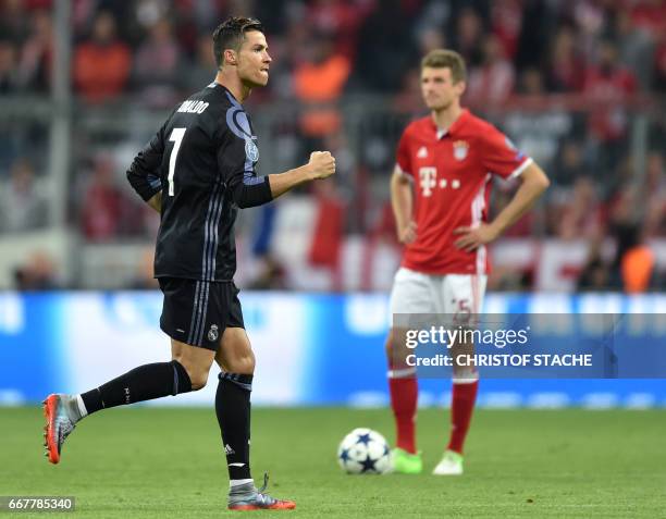 Real Madrid's Portuguese striker Cristiano Ronaldo reacts after his first goal during the UEFA Champions League 1st leg quarter-final football match...