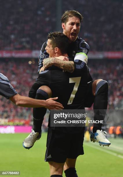 Real Madrids Portuguese striker Cristiano Ronaldo and Real Madrids defender Sergio Ramos celebrate after the second goal during the UEFA Champions...