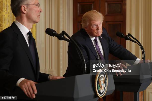 Secretary General Jens Stoltenberg and U.S. President Donald Trump hold a news conference in the East Room of the White House April 12, 2017 in...