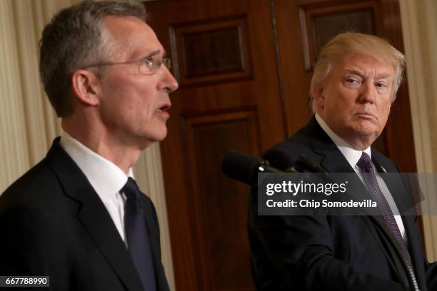 Secretary General Jens Stoltenberg and U.S. President Donald Trump hold a news conference in the East Room of the White House April 12, 2017 in...