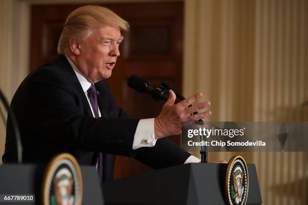 President Donald Trump holds a news conference with NATO Secretary General Jens Stoltenberg in the East Room of the White House April 12, 2017 in...