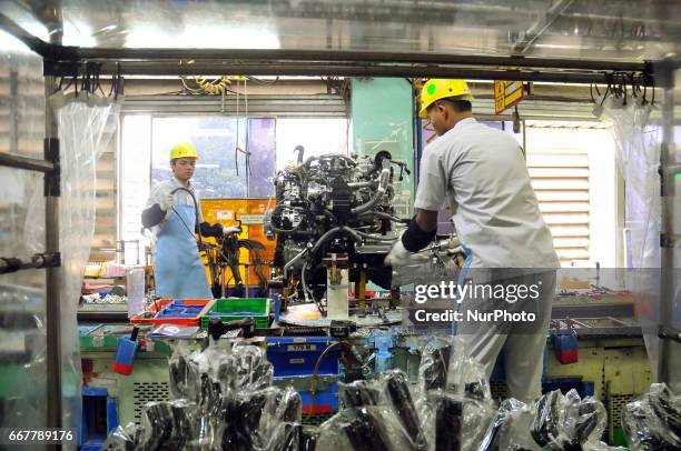 Workers installing components to automobile vehicles at Toyota Motor Manufacturing Indonesia, Karawang, West Java, on March 31,2017. Toyota Motor...