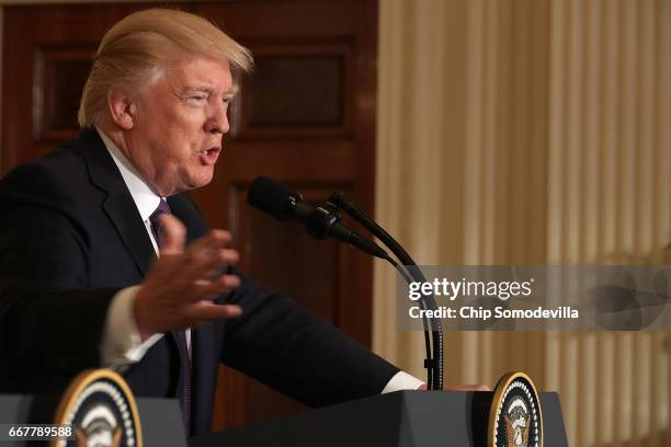 President Donald Trump holds a news conference with NATO Secretary General Jens Stoltenberg in the East Room of the White House April 12, 2017 in...