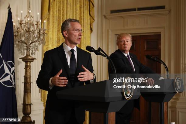 Secretary General Jens Stoltenberg and U.S. President Donald Trump hold a news conference in the East Room of the White House April 12, 2017 in...