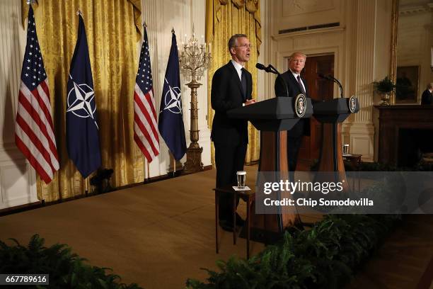 Secretary General Jens Stoltenberg and U.S. President Donald Trump hold a news conference in the East Room of the White House April 12, 2017 in...