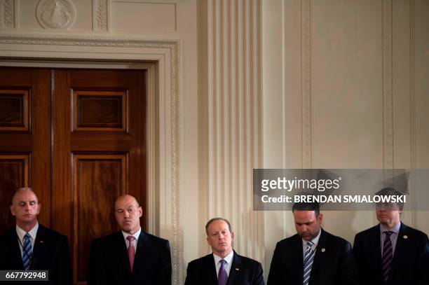 Director of Oval Office operations Keith Schiller , National Economic Council Director Gary Cohn , White House Press Secretary Sean Spicer and others...