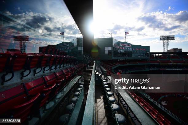 The Fenway Park facade is seen through a reflection before the Boston Red Sox game against the Baltimore Orioles at Fenway Park on April 12, 2017 in...