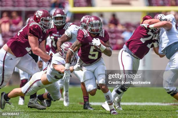 Texas A&M running back Trayveon Williams runs through a tackle during the Texas A&M Aggies Spring Game on April 8 at Kyle Field in College Station,...