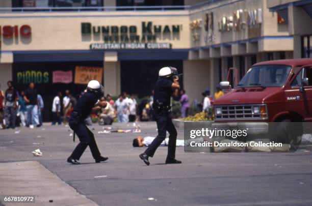 Police and rioters clash at a shopping center located at 116 S. Vermont Ave in widespread riots that erupted after the acquittal of 4 LAPD officers...