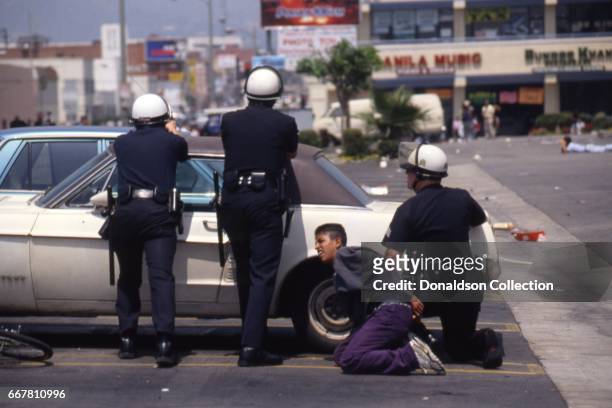 Police and rioters clash at a shopping center located at 116 S. Vermont Ave in widespread riots that erupted after the acquittal of 4 LAPD officers...