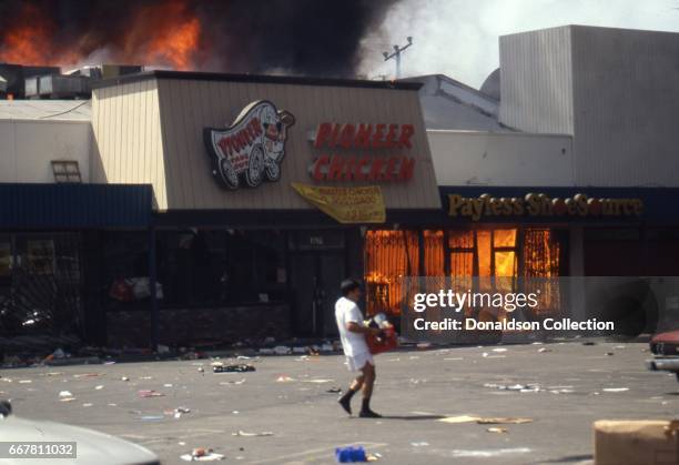 Pioneer Chicken and Payless Shoe Source on fire on Vermont Avenue during widespread riots that erupted after the acquittal of 4 LAPD officers in the...