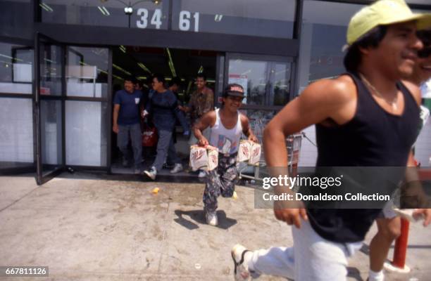 Looters at the Vons grocery store at 3461 W 3rd Street during widespread riots that erupted after the acquittal of 4 LAPD officers in the videotaped...