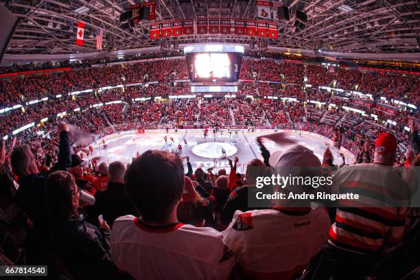 Fans cheer during pre game ceremonies prior to the Ottawa Senators facing the Boston Bruins in Game One of the Eastern Conference First Round during...