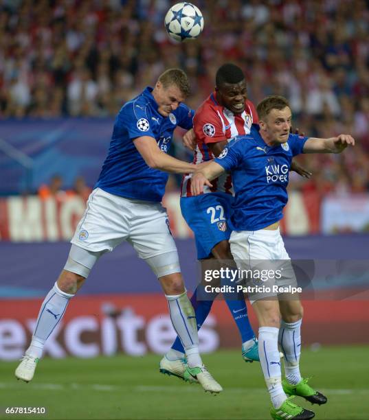 Thomas of Atletico de Madrid fights the ball with Robert Huth and Jamie Vardy of Leicester City during the match between Club Atletico de Madrid v...