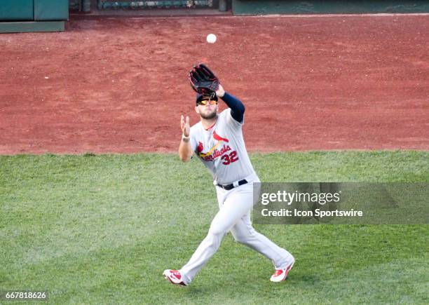 St. Louis Cardinals left fielder Matt Adams fields a fly ball in the fifth inning against the Washington Nationals on April 12 at Nationals Park in...