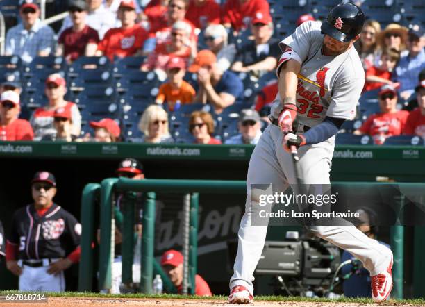 St. Louis Cardinals left fielder Matt Adams hits a single in the first inning against the Washington Nationals on April 12 at Nationals Park in...