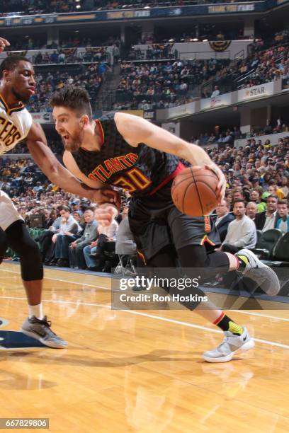 Ryan Kelly of the Atlanta Hawks drives to the basket against the Indiana Pacers on April 12, 2017 at Bankers Life Fieldhouse in Indianapolis,...