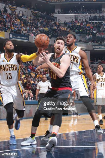 Ryan Kelly of the Atlanta Hawks drives to the basket against the Indiana Pacers on April 12, 2017 at Bankers Life Fieldhouse in Indianapolis,...