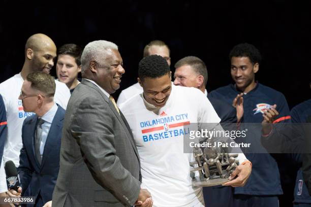 Oscar Robertson and Russell Westbrook of the Oklahoma City Thunder talk during the ceremony honoring Westbrook for breaking Roberston's triple double...