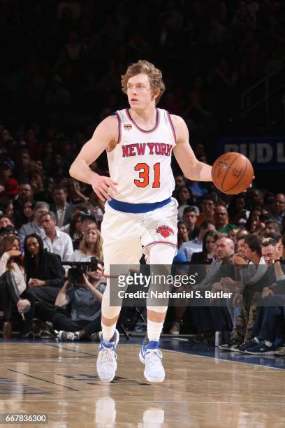Ron Baker of the New York Knicks handles the ball against the Philadelphia 76ers on April 12, 2017 at Madison Square Garden in New York City, New...