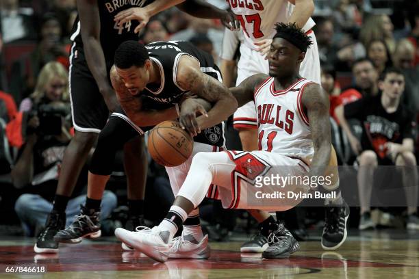 McDaniels of the Brooklyn Nets and Anthony Morrow of the Chicago Bulls battle for a loose ball in the fourth quarter at United Center on April 12,...