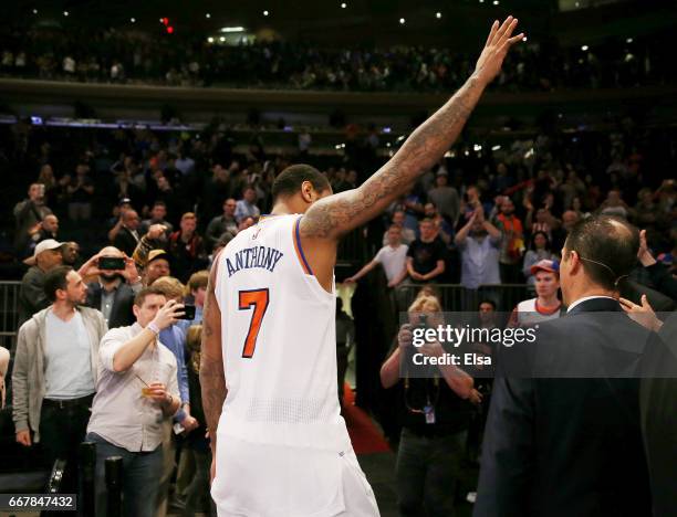 Carmelo Anthony of the New York Knicks waves to the fans as he walks off the court after the 114-113 win over the Philadelphia 76ers at Madison...