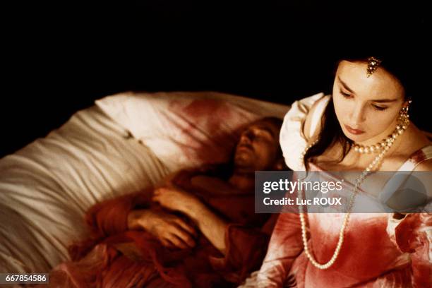 French actress Isabelle Adjani and French actor Jean-Hugues Anglade on the set of the 1994 film La Reine Margot , directed by Patrice Chereau.