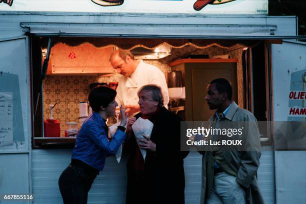 French actress and director Valerie Lemercier with French actors Claude Rich and Dieudonne on the set of Lemercier's film Le Derriere.