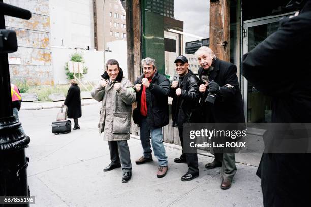 French actor Bruno Putzulu, actor and director Michel Boujenah, a member of the film crew, and actor Philippe Noiret on the set of Boujenah's film...