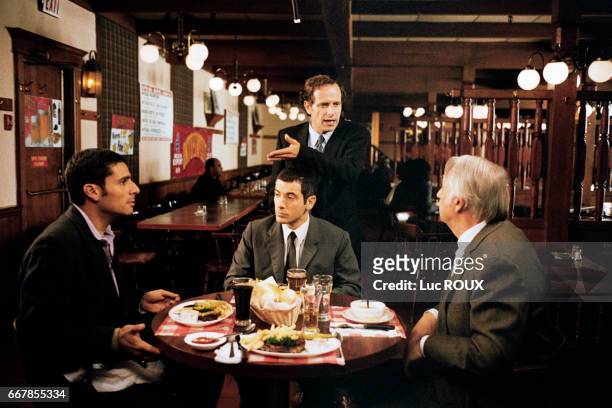 French actors Pascal Elbe, Bruno Putzulu, Charles Berling, and Philippe Noiret on the set of the film Pere et Fils, directed by Michel Boujenah.