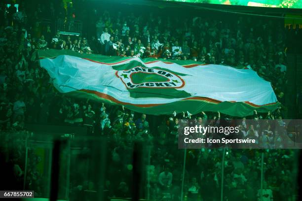 Fans unfurl the State of Hockey flag prior to the start of Game 1 of the Western Conference Quarterfinals between the St. Louis Blues and the...