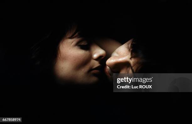 French actors Marie Trintignant and Jean-Hugues Anglade on the set of the film Nuit d'Ete en Ville , directed by Michel Deville.