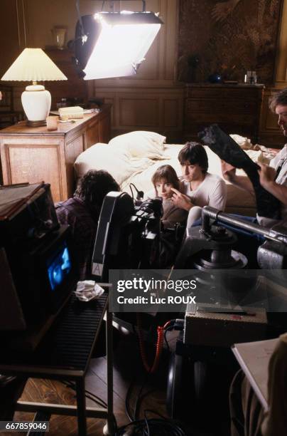 French actors Marie Trintignant and Jean-Hugues Anglade on the set of the film Nuit d'Ete en Ville , directed by Michel Deville.