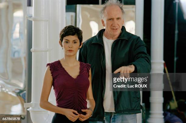 French actress Audrey Tautou and Israelian-born director Amos Kollek on the set of Kollek's film Happy End .