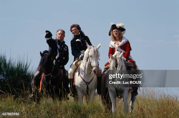 French actors Jean-Pierre Cassel, Stephane Freiss, and Charlotte de Turckheim on the set of Chouans!, directed by Philippe de Broca.