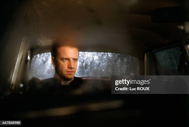 French actor Christophe Lambert on the set of the film To Kill a Priest, directed by Agnieszka Holland. Also know as Le Complot, the film is inspired...