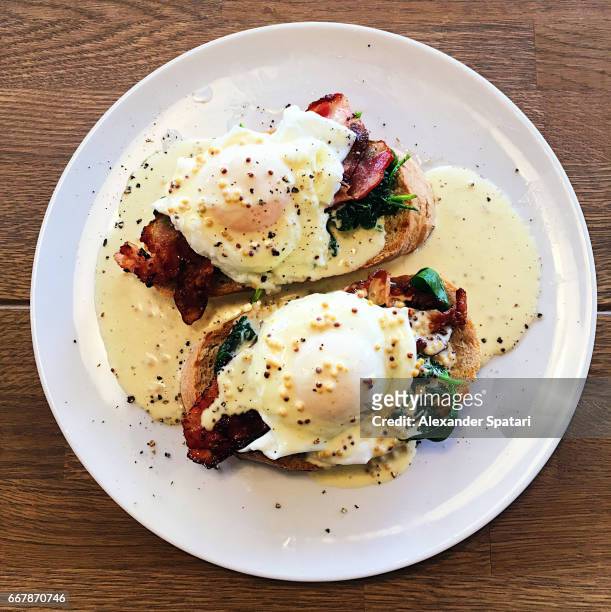 eggs benedict close up, high angle view - eggs benedict stock pictures, royalty-free photos & images