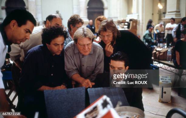 Spanish actor Antonio Banderas with British director, screenwriter and producer Alan Parker on the set of his musical film Evita, based on the book...