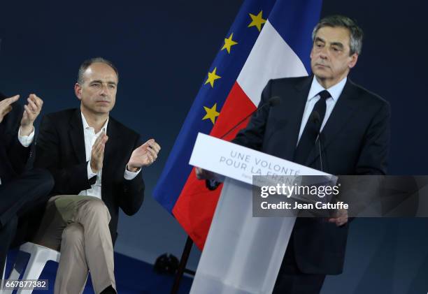 Jean-Francois Cope listens to French presidential candidate Francois Fillon of Les Republicains hosting a rally party at Porte de Versailles on April...