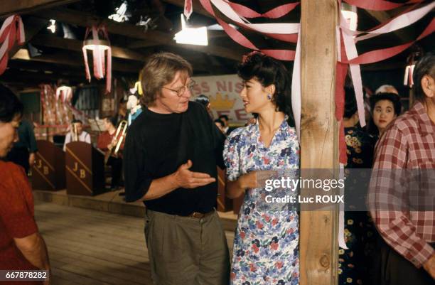 English director Alan Parker and Japanese-American actress Tamlyn Tomita on the set of Parker's film Come See the Paradise.