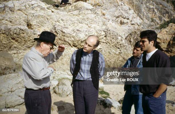 Portuguese director Manoel de Oliveira and American actor John Malkovich on the set of de Oliveira's film O Couvent .