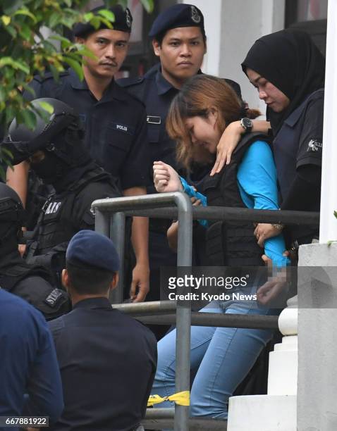 Doan Thi Huong , a Vietnamese, leaves a court near Kuala Lumpur on April 13 after judicial proceedings against her and Siti Aisyah, an Indonesian,...
